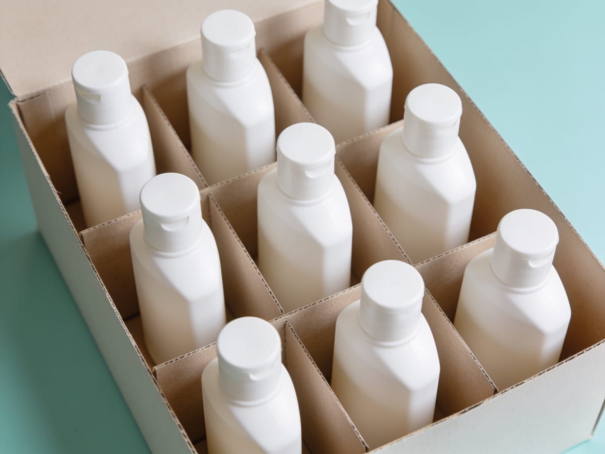 Export packing of haircare bottles – Harrods Health